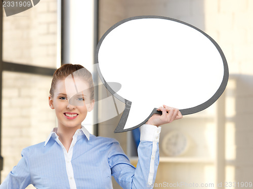 Image of smiling businesswoman with blank text bubble