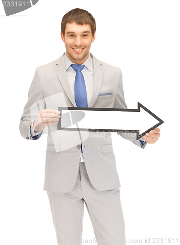 Image of businessman with direction arrow sign