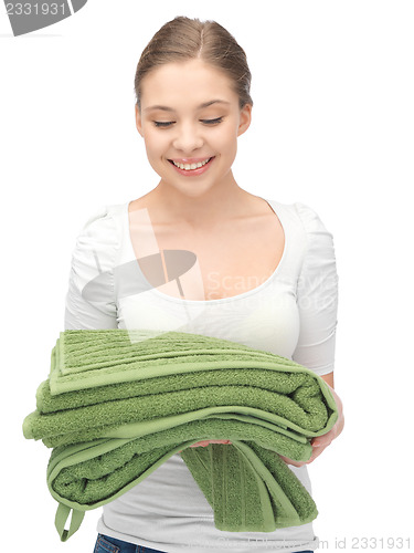 Image of lovely housewife with towels