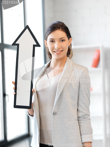 Image of businesswoman with direction arrow sign
