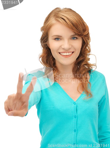 Image of teenage girl showing victory sign