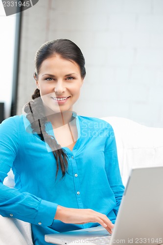 Image of happy woman with laptop computer