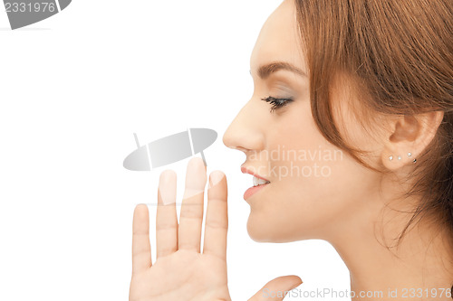 Image of woman whispering gossip