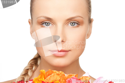Image of lovely woman with red flowers