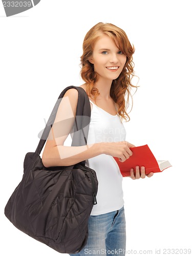 Image of teenage girl in blank white t-shirt with book