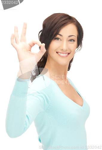 Image of young woman showing ok sign