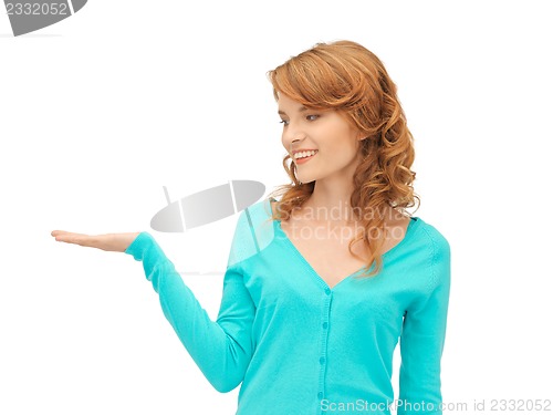 Image of girl showing something on the palm of her hand