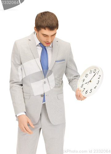 Image of man with clock