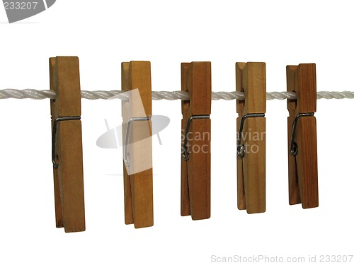 Image of Wooden clothespins on a clothes line (+ clipping path)