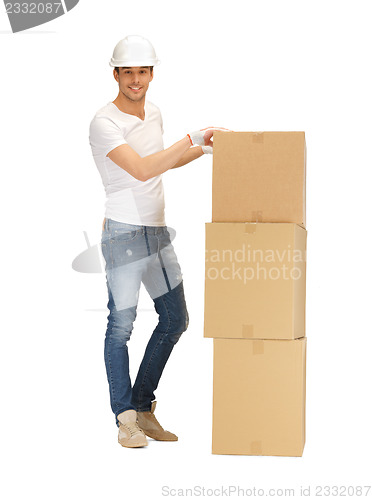 Image of handsome man with big boxes