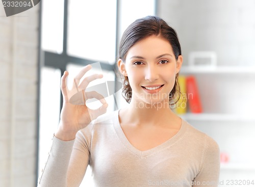 Image of lovely teenage girl showing ok sign