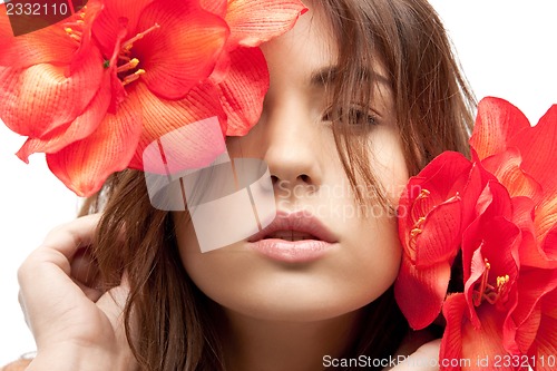 Image of lovely woman with red flowers