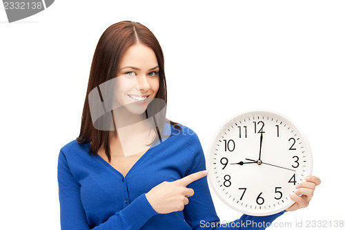 Image of woman holding big clock