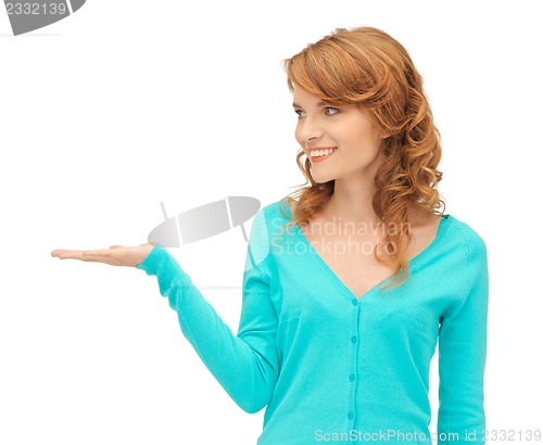 Image of girl showing something on the palm of her hand