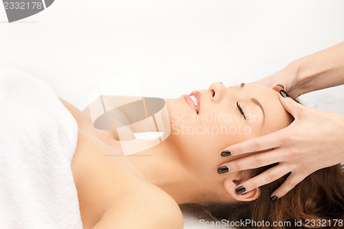 Image of beautiful woman in massage salon