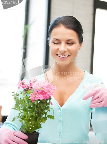 Image of lovely housewife with flower