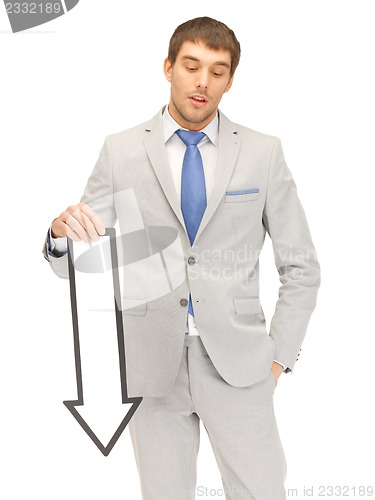 Image of businessman with direction arrow sign