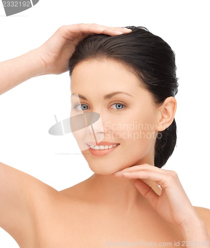 Image of face and hands of beautiful woman