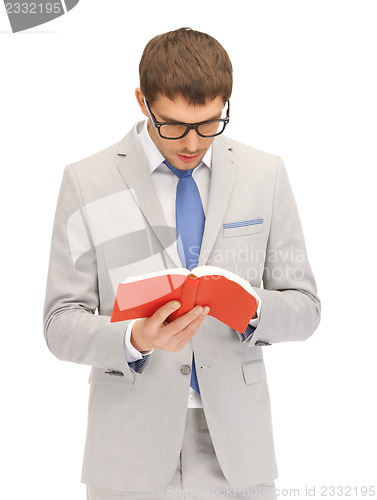 Image of calm and serious man with book