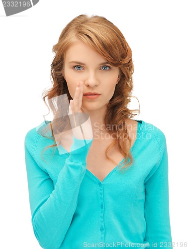 Image of teenage girl whispering gossip