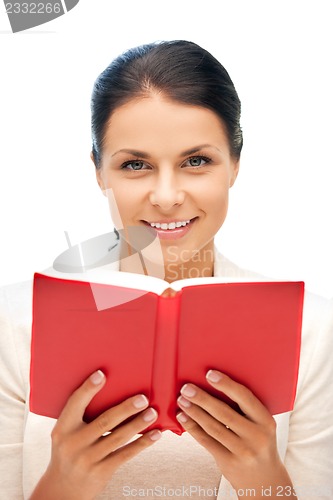 Image of happy and smiling woman with book