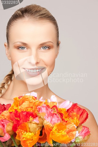 Image of lovely woman with red flowers