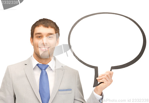 Image of smiling businessman with blank text bubble