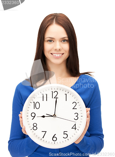 Image of woman holding big clock