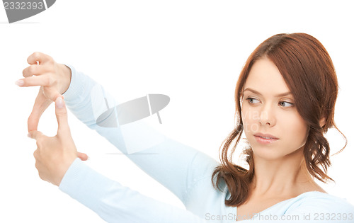 Image of lovely woman creating a frame with fingers
