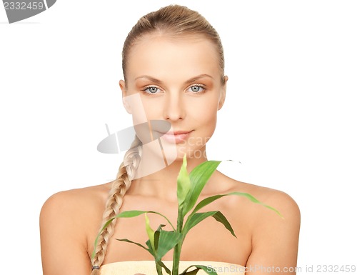 Image of woman with green sprout