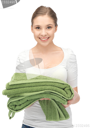 Image of lovely housewife with towels