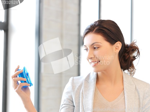Image of businesswoman with clock
