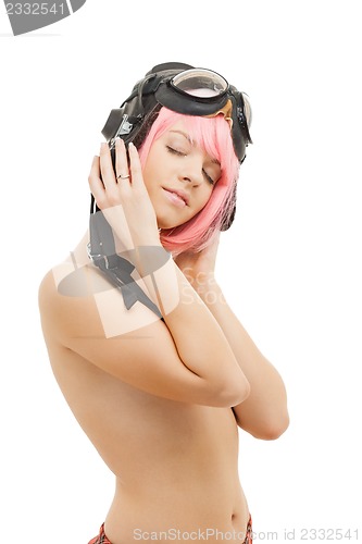 Image of topless pink hair girl in aviator helmet