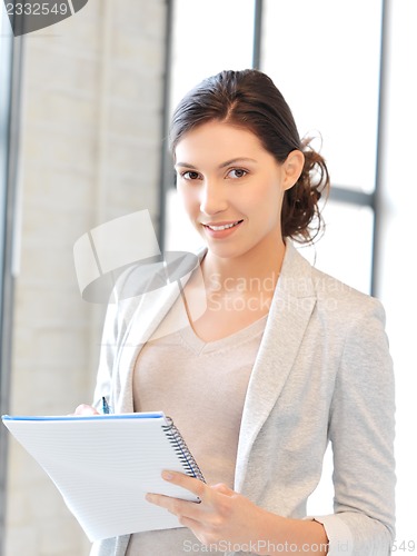 Image of happy woman with big notepad