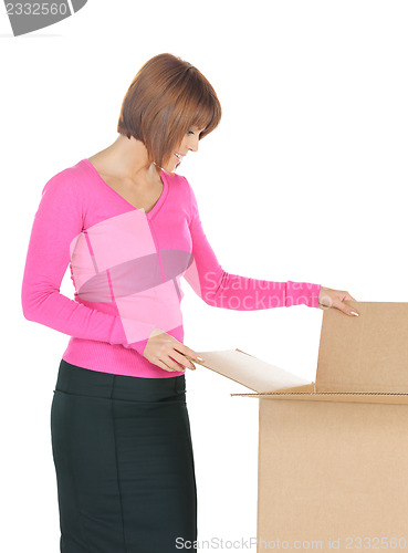 Image of attractive businesswoman with cardboard box