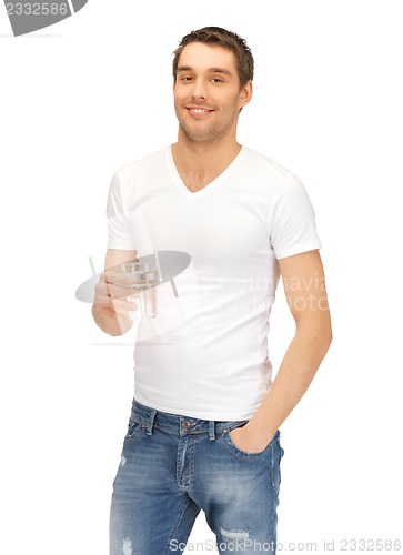 Image of man in white shirt with glass of water