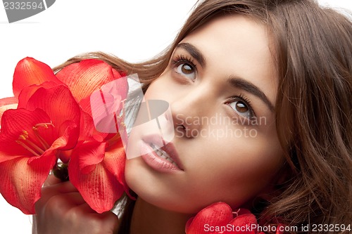 Image of lovely woman with red flowers
