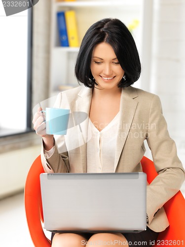 Image of happy woman with laptop computer