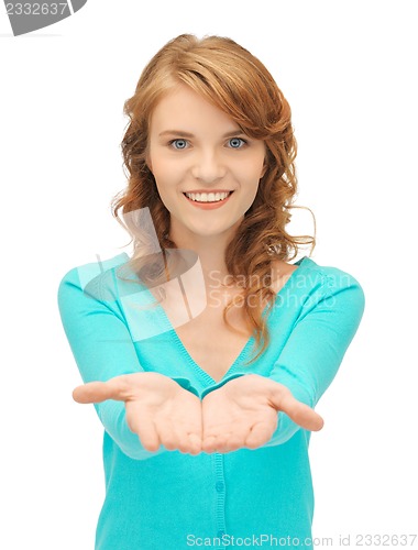 Image of girl showing something on the palms of her hands