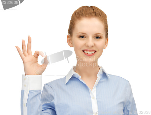 Image of young woman showing ok sign