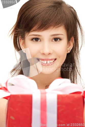 Image of happy teenage girl with gift box