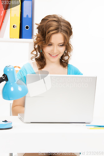 Image of happy woman with laptop computer