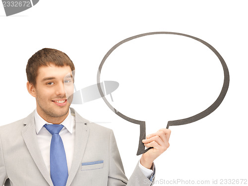 Image of smiling businessman with blank text bubble