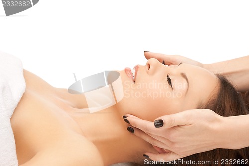 Image of beautiful woman in massage salon