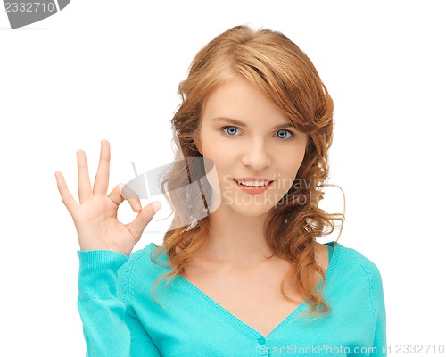 Image of teenage girl showing ok sign