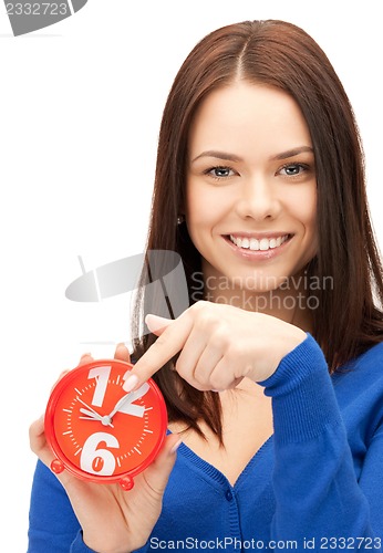 Image of woman holding alarm clock