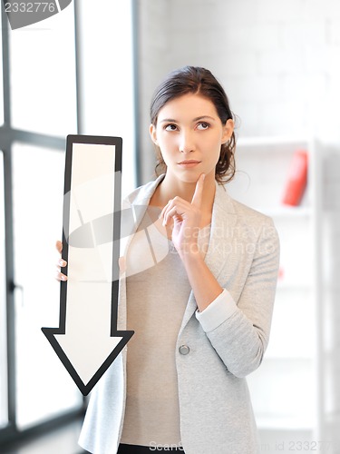 Image of businesswoman with direction arrow sign