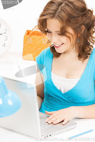 Image of happy woman with laptop computer