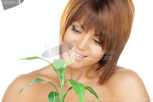 Image of woman with green sprout