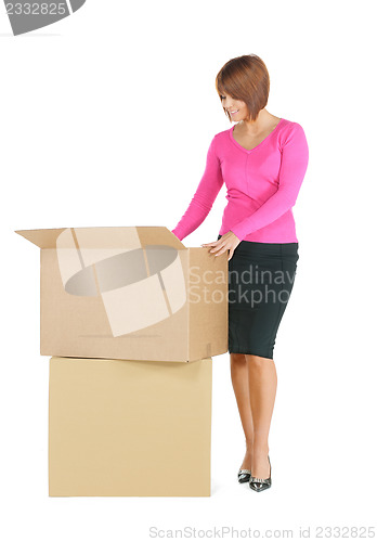 Image of attractive businesswoman with big boxes